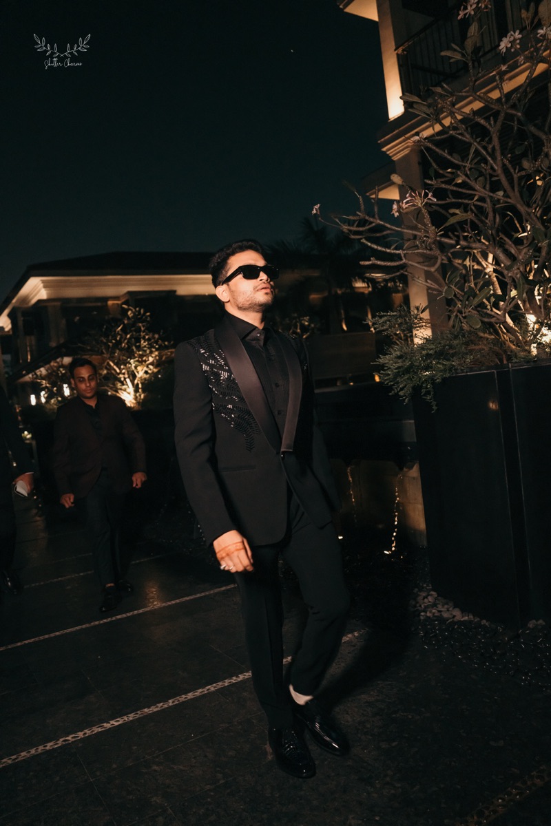 Groom in black at a night celebration in Jaipur